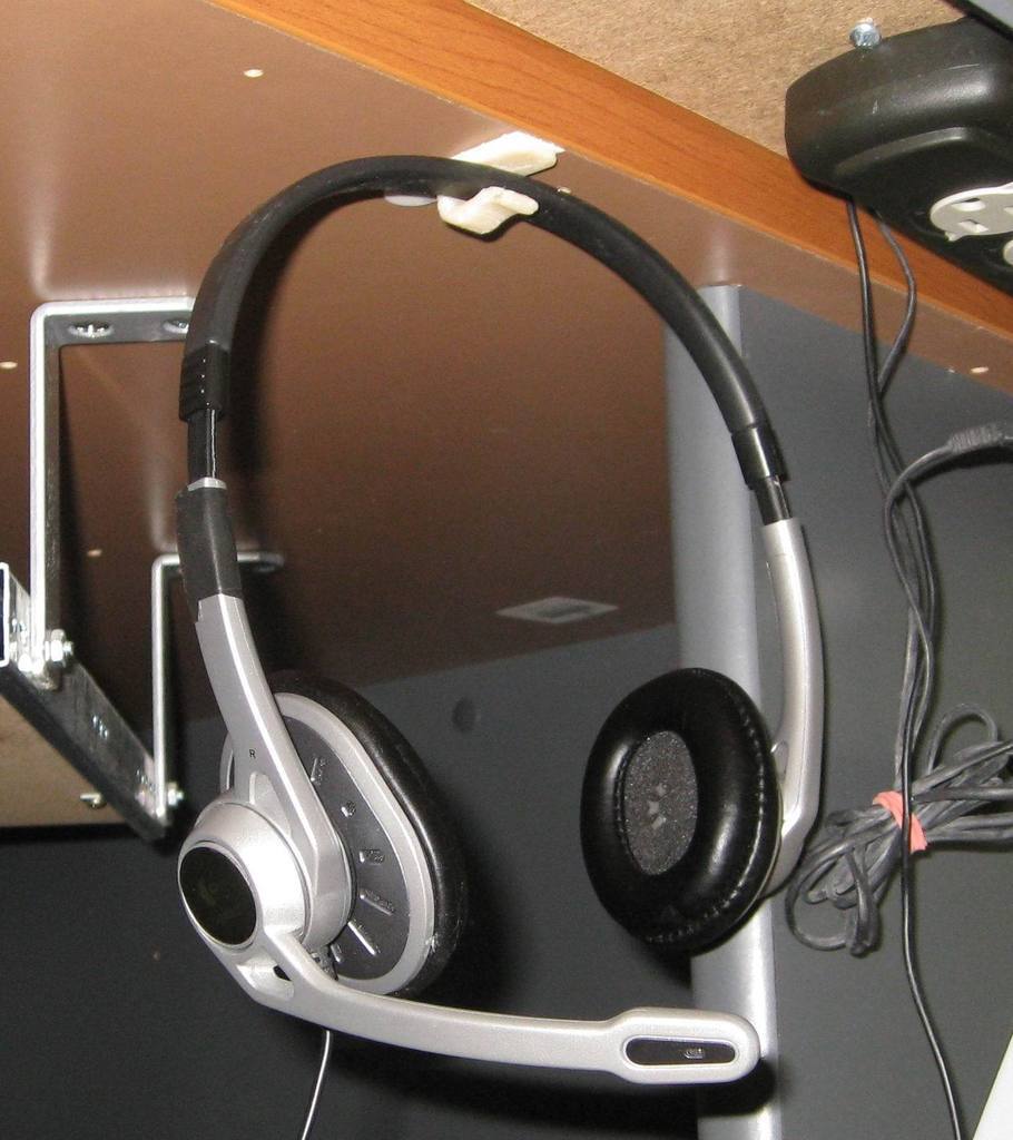 Organizador de cables y gancho para auriculares versátil