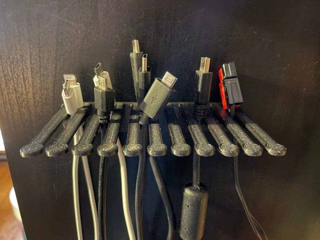Pequeño soporte para cables para montaje en pared