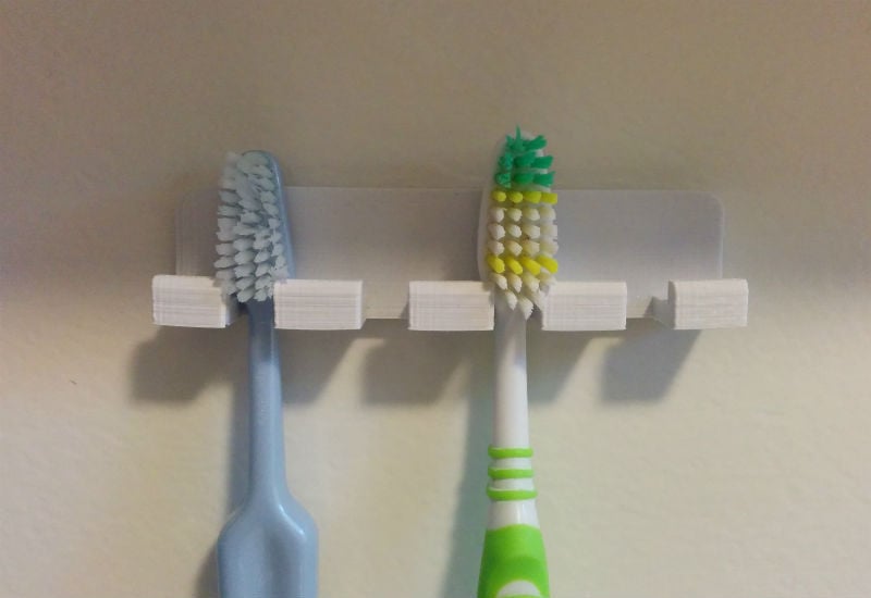 Soporte de pared para cepillos de dientes con bordes redondeados