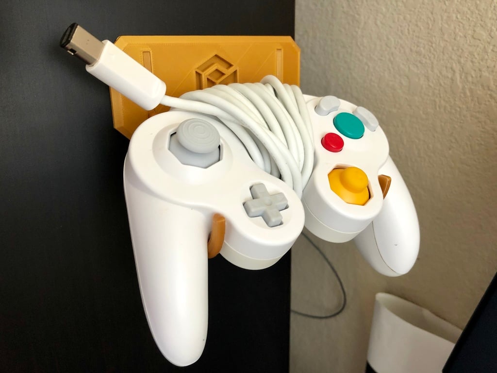 Soporte y gancho para mando de GameCube