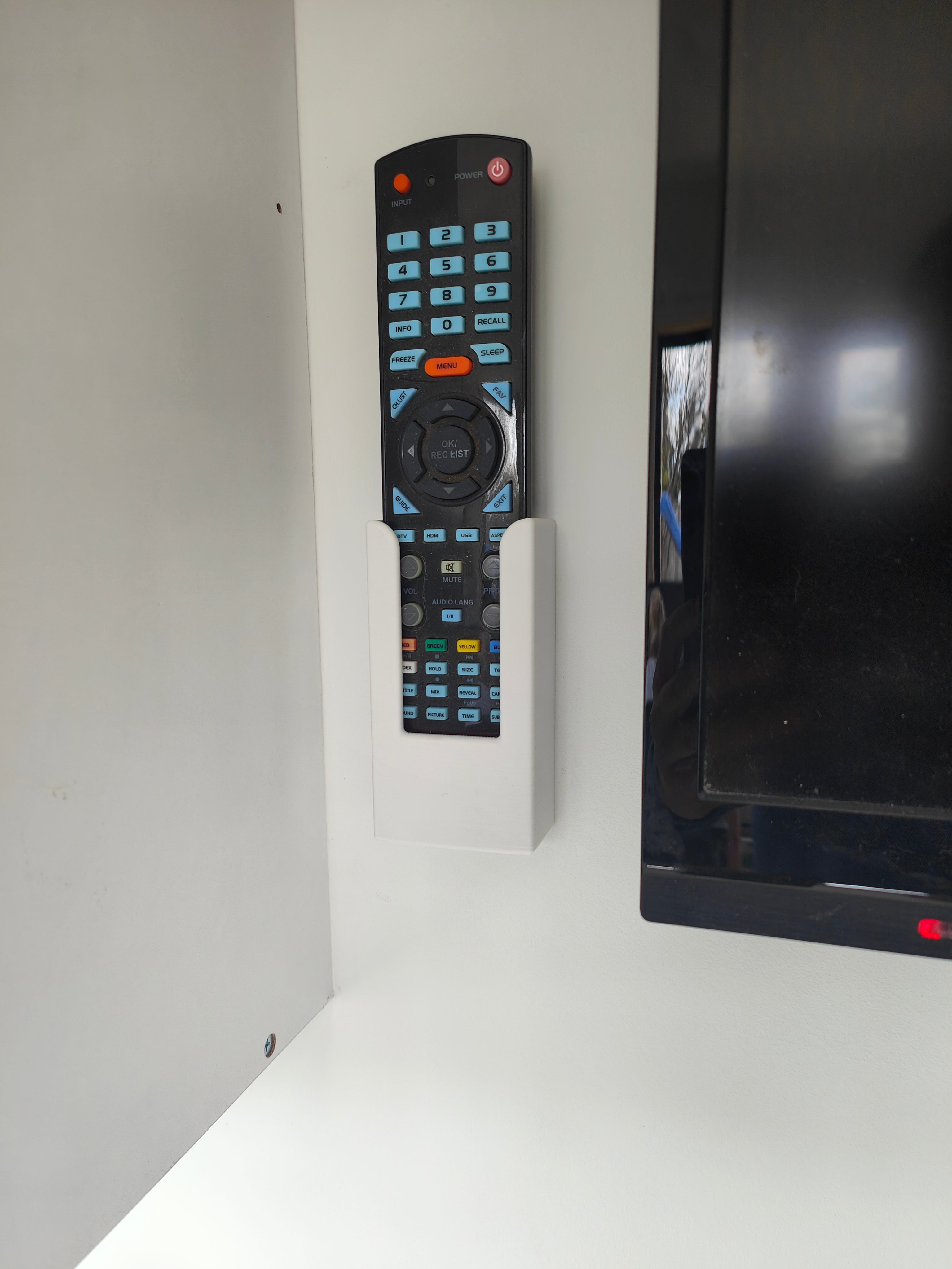 Soporte de pared para mando a distancia de TV Konka