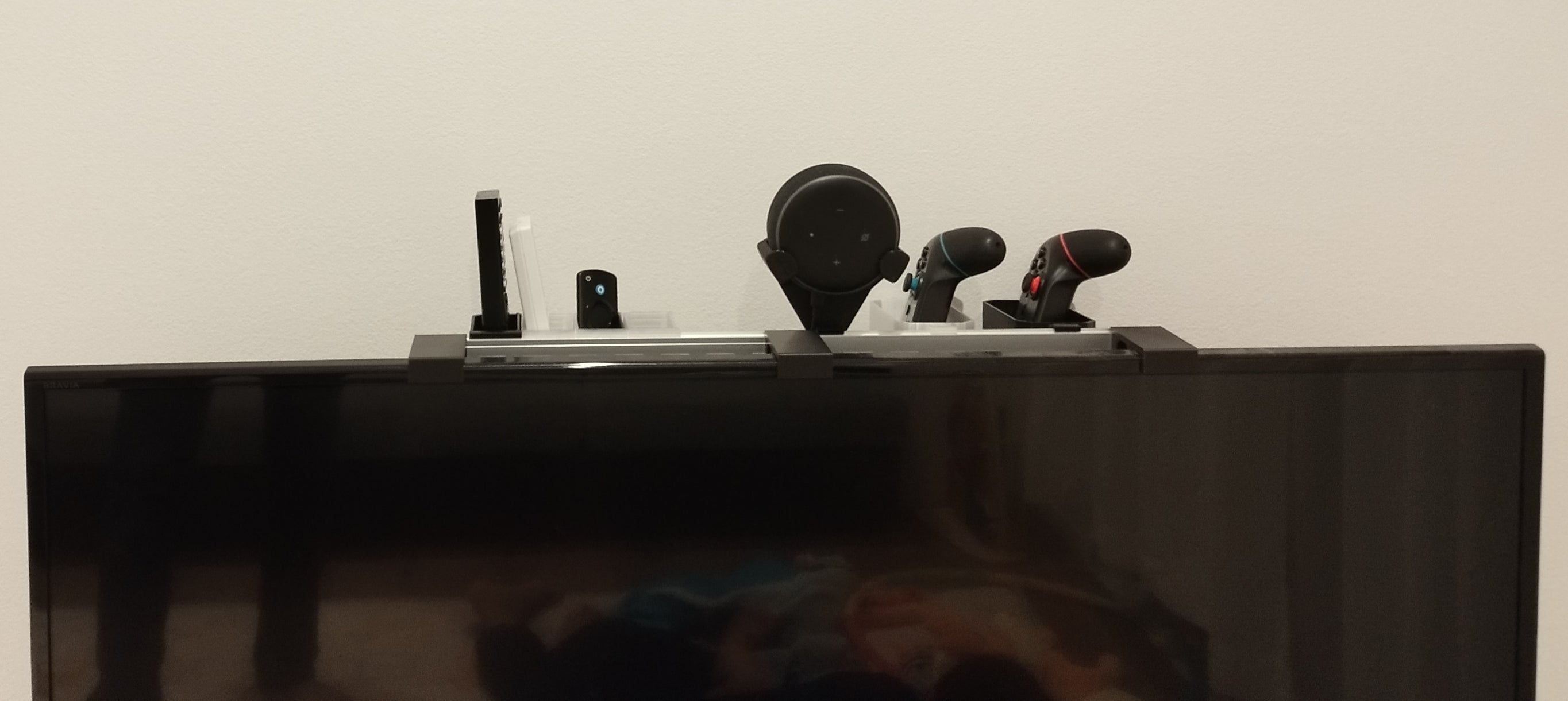 Soporte de control remoto para TV con riel DIN