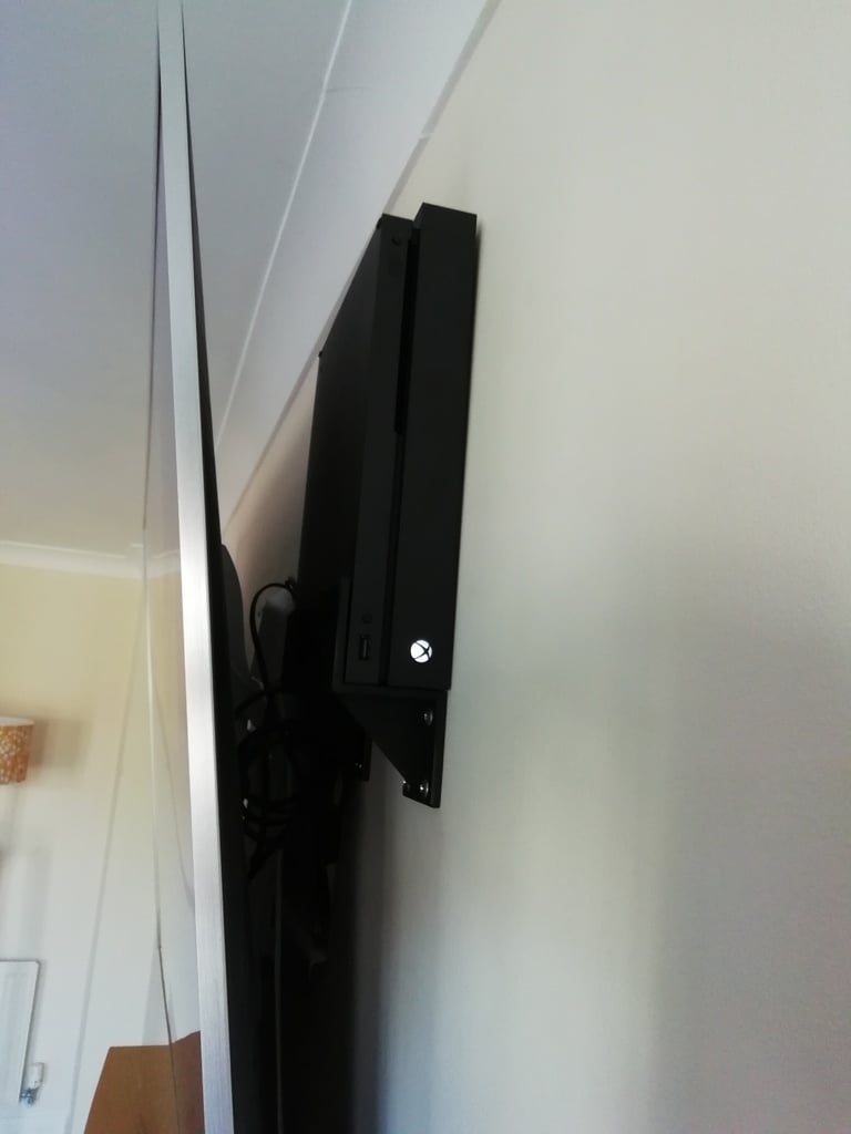 XBox One X - Soporte de pared