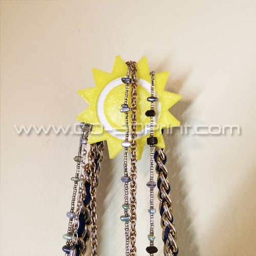Colgador de pared y organizador con forma de sol para abrigos y joyas