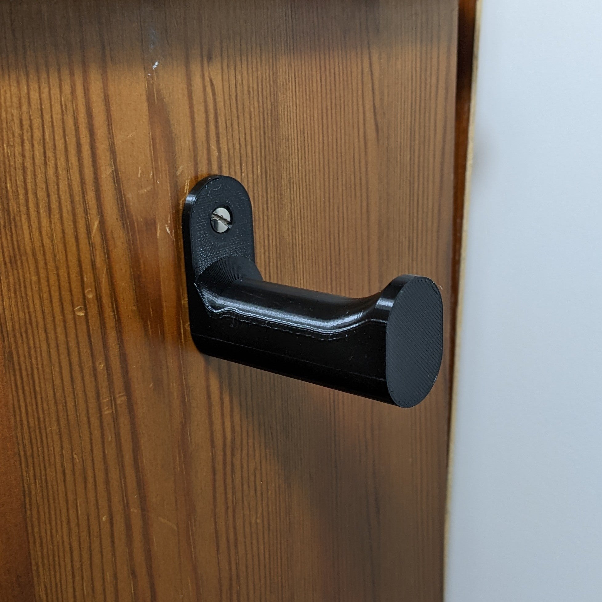 Soporte de pared para auriculares – Diseño compacto