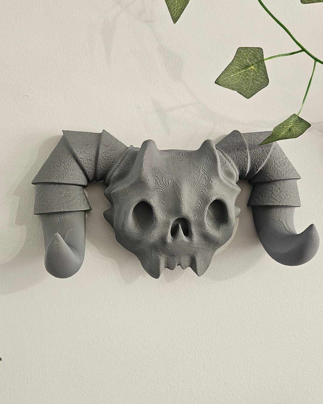 Gancho de pared con cráneo de demonio