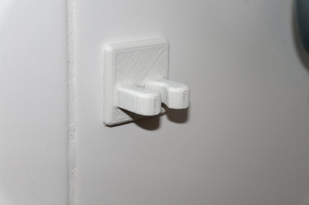 Soporte de pared para cables para cables organizados