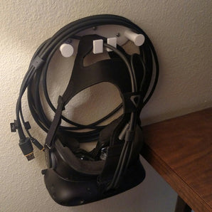 Soporte de pared para auriculares VR con almacenamiento de cables