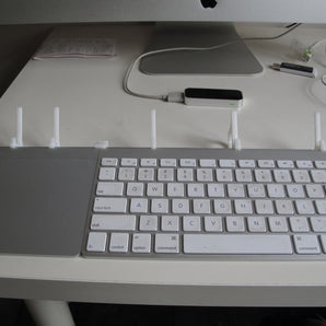 Soporte simple para iPhone y iPad con integración para teclado y trackpad inalámbricos de Apple