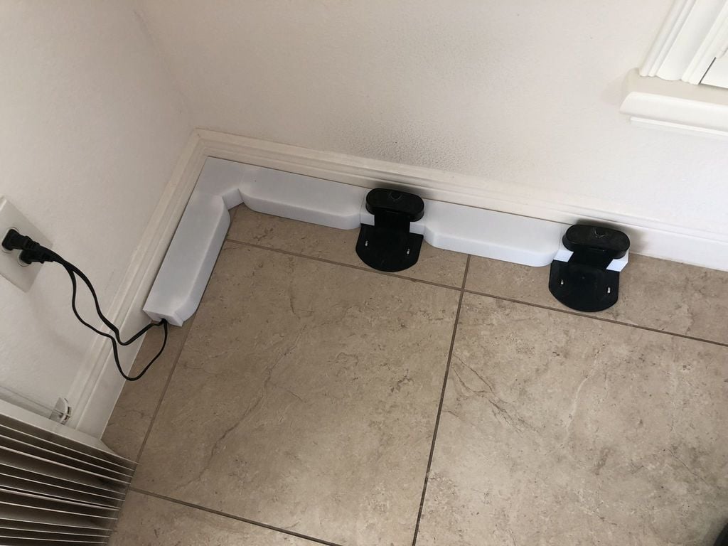 Estación de acoplamiento Roomba y sistema de gestión de cables