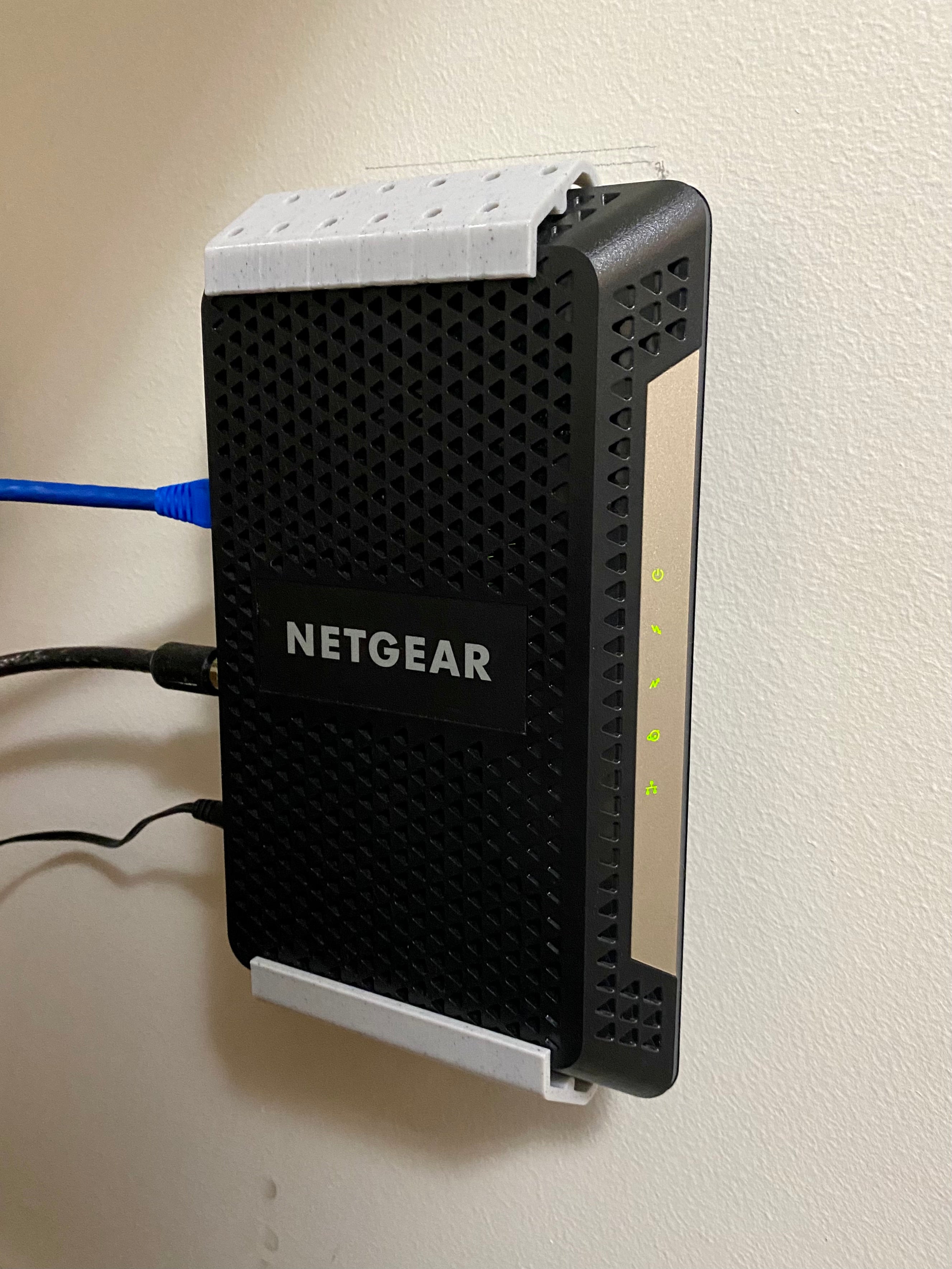 Montaje en pared Netgear CM600 / CM1000: optimice la configuración de su red