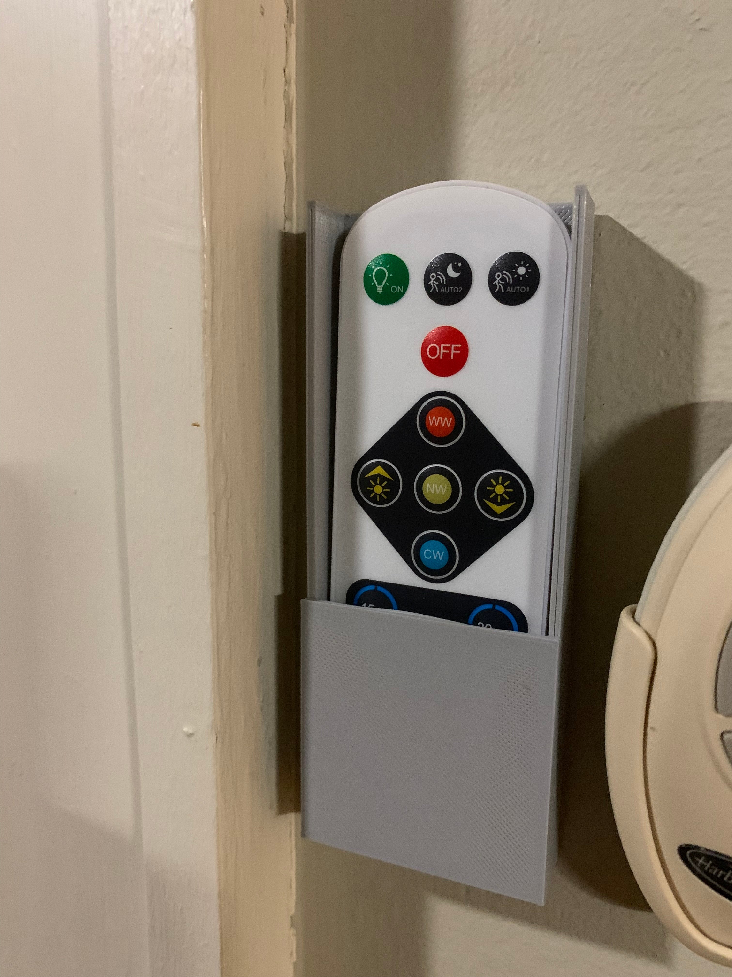 Soporte de pared para mando a distancia