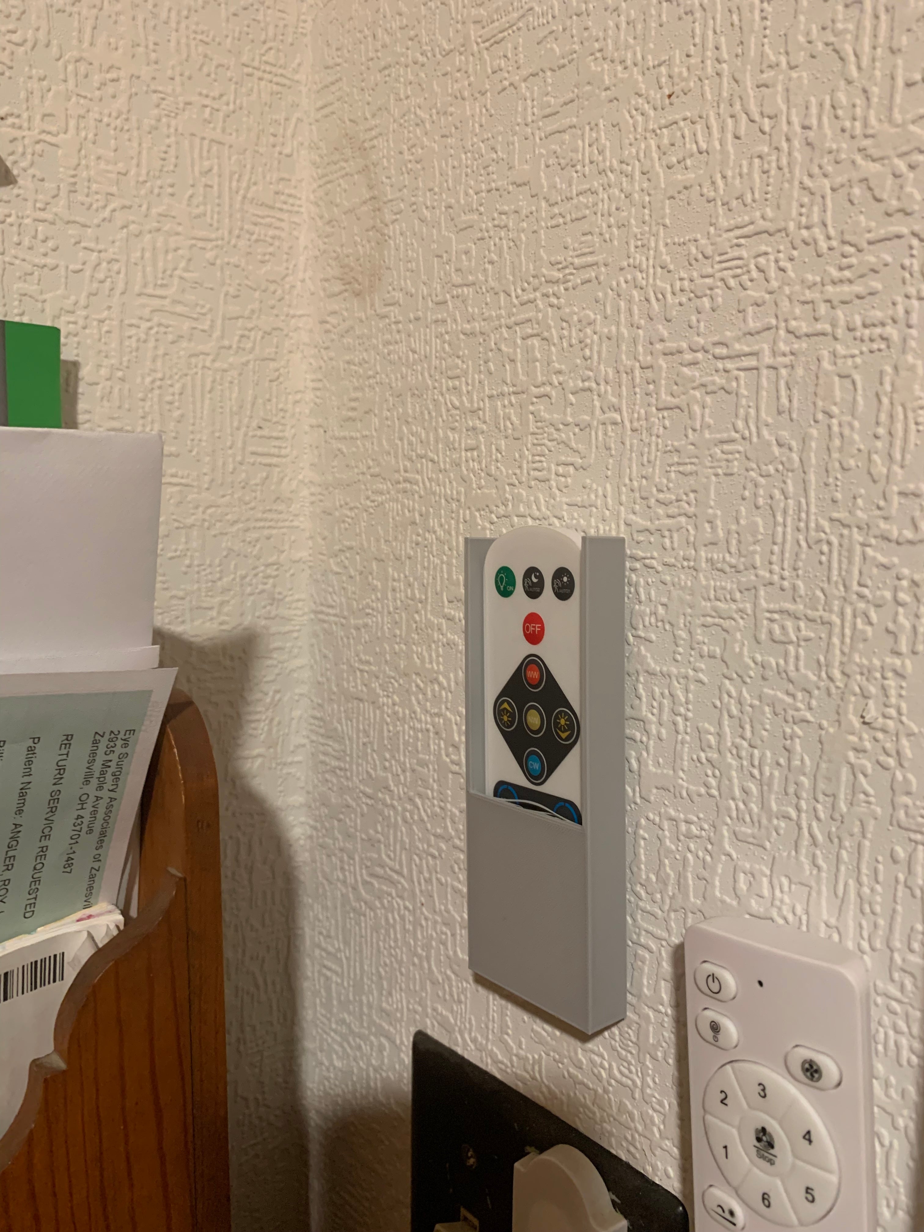 Soporte de pared para mando a distancia