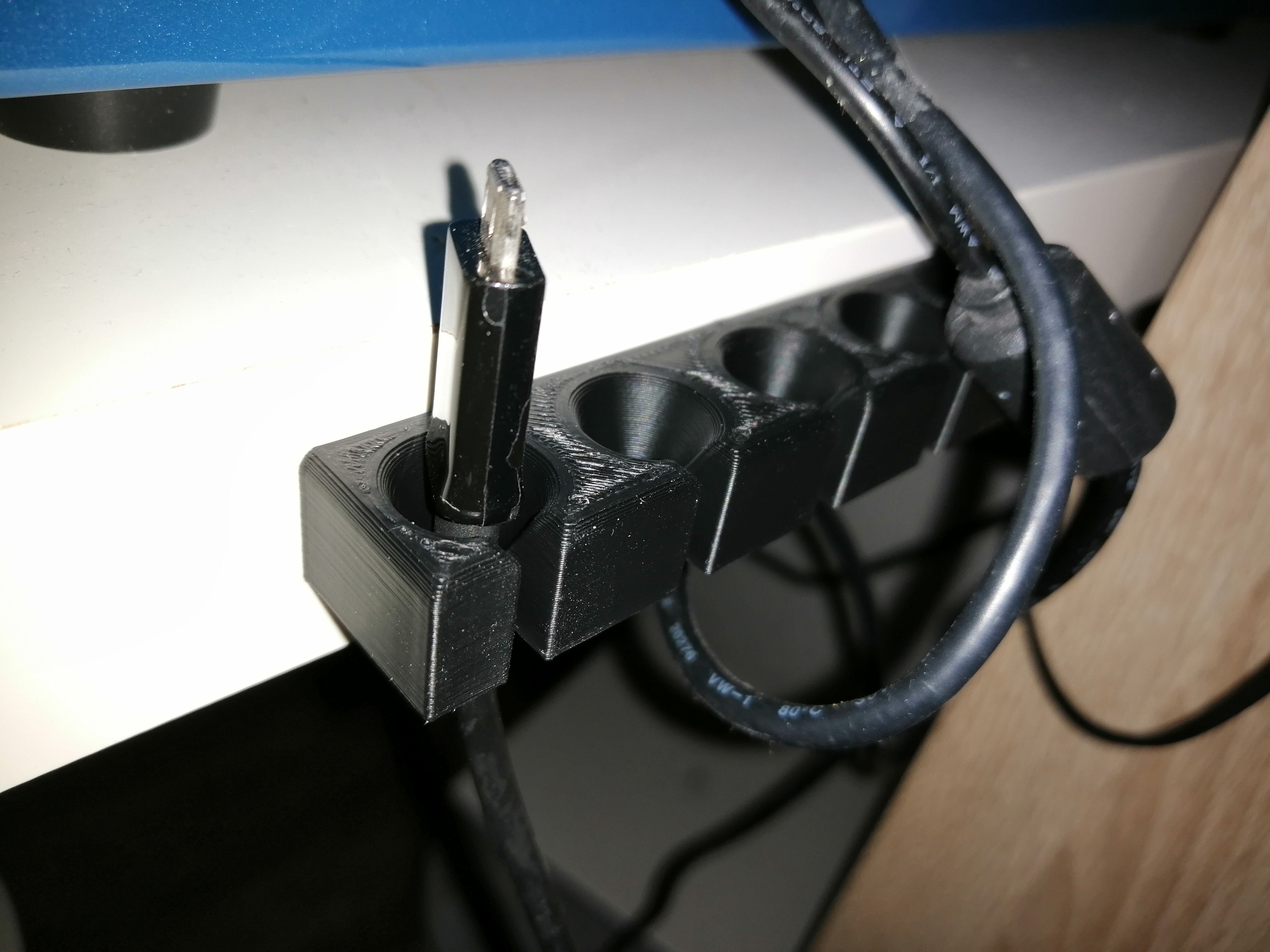 Soporte para cables USB para organizar los cables