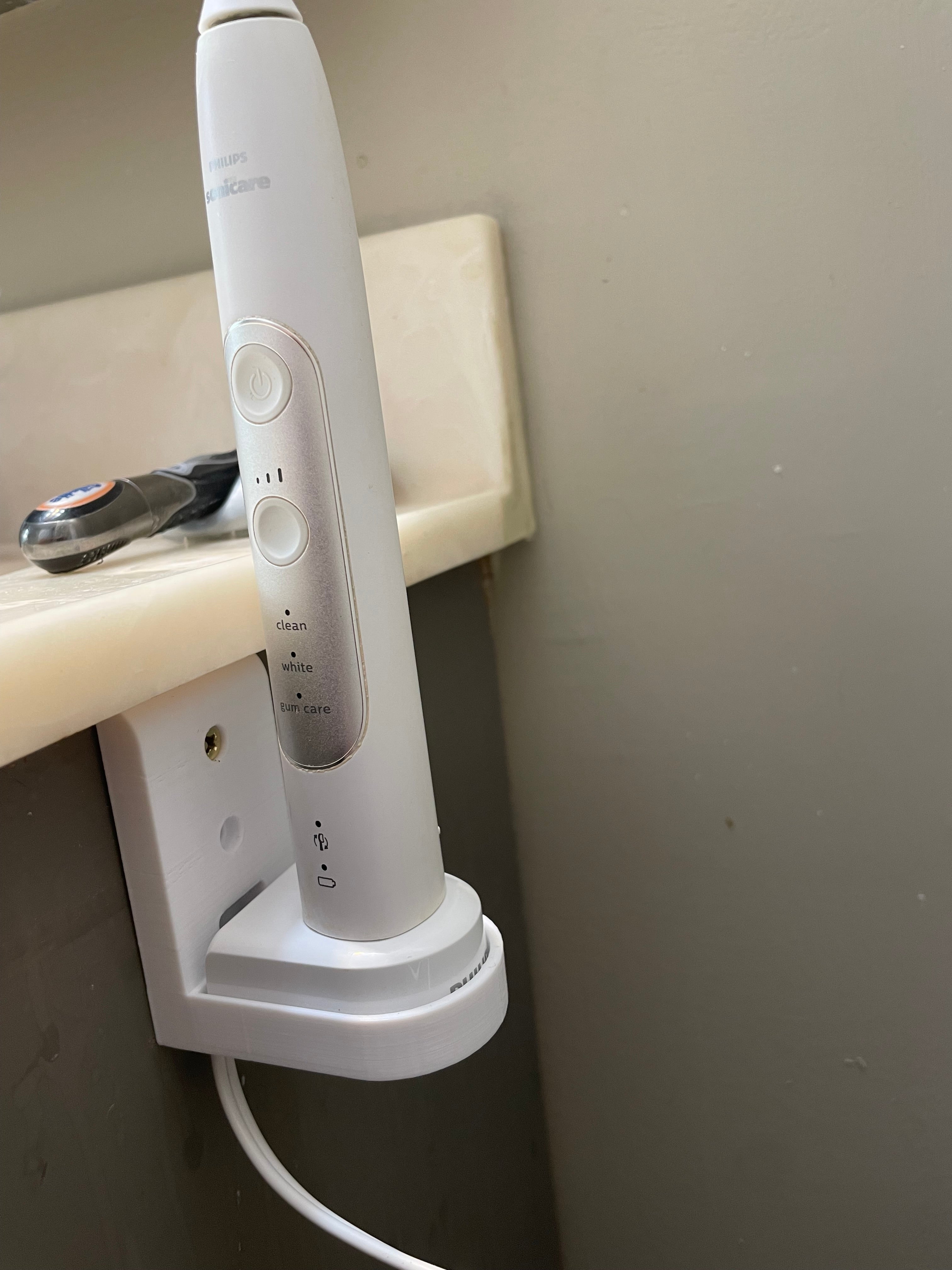 Cargador Philips Sonicare montado en la pared
