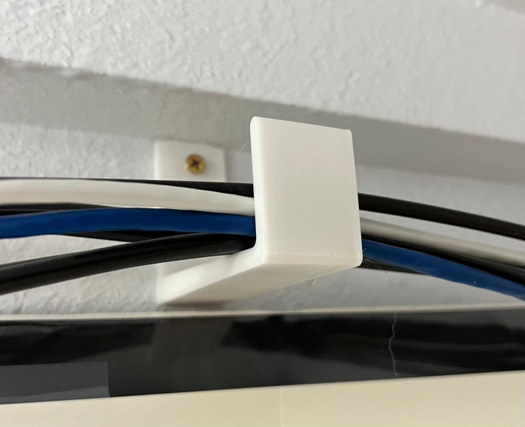 Soporte de pared para cables, tuberías y alambres