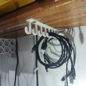 Práctico sujetacables para montaje debajo del estante