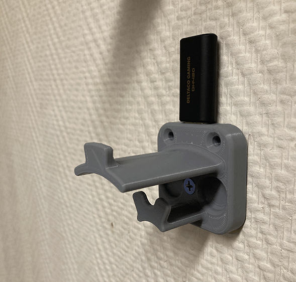 Soporte para auriculares con gestión de cables y espacio para dongle USB