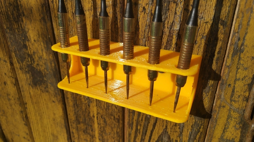 Soporte de pared para dardos para 6 dardos