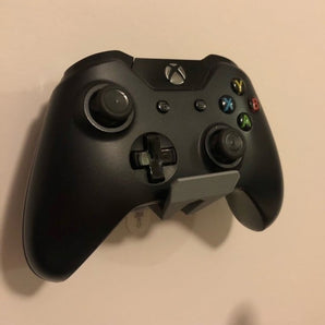 Soporte de pared para mandos de juegos con tiras Command