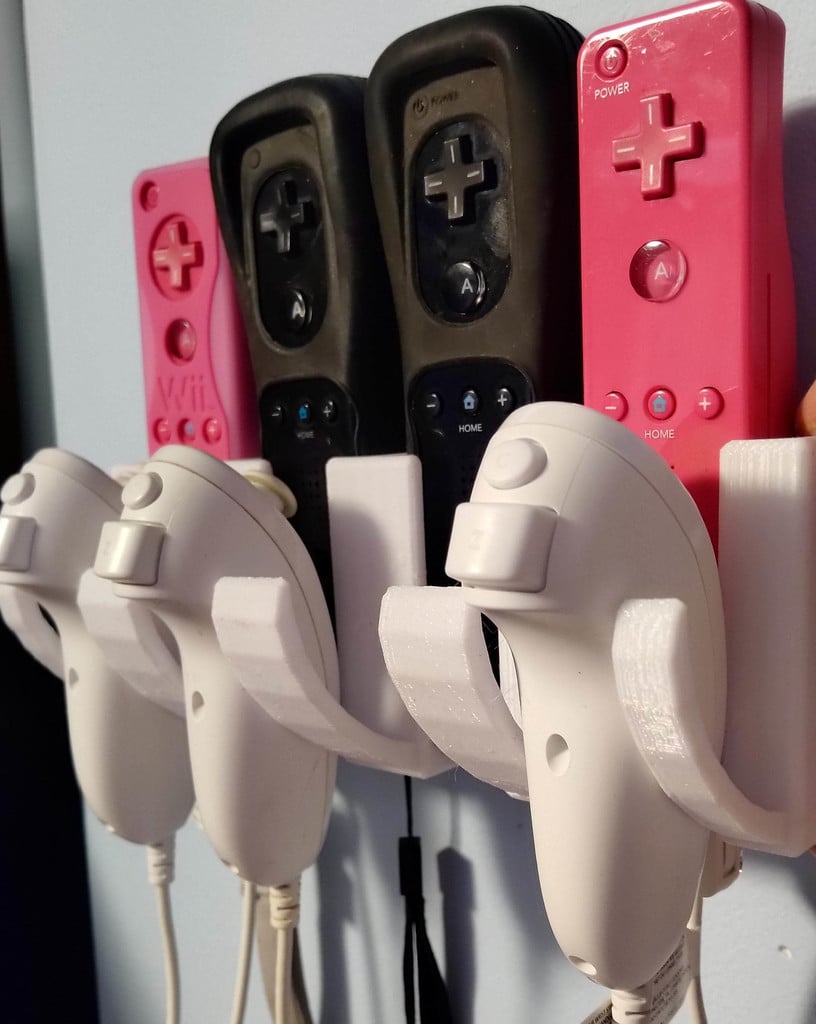 Soporte de montaje en pared para mando de Wii y Nunchuck