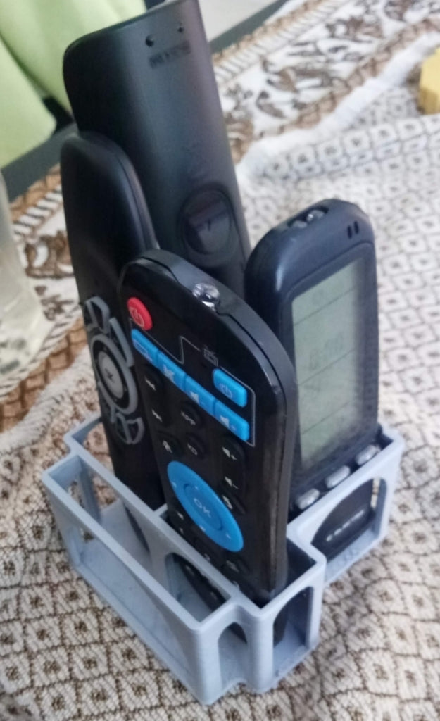 Caja soporte para mando a distancia con soporte para smartphone