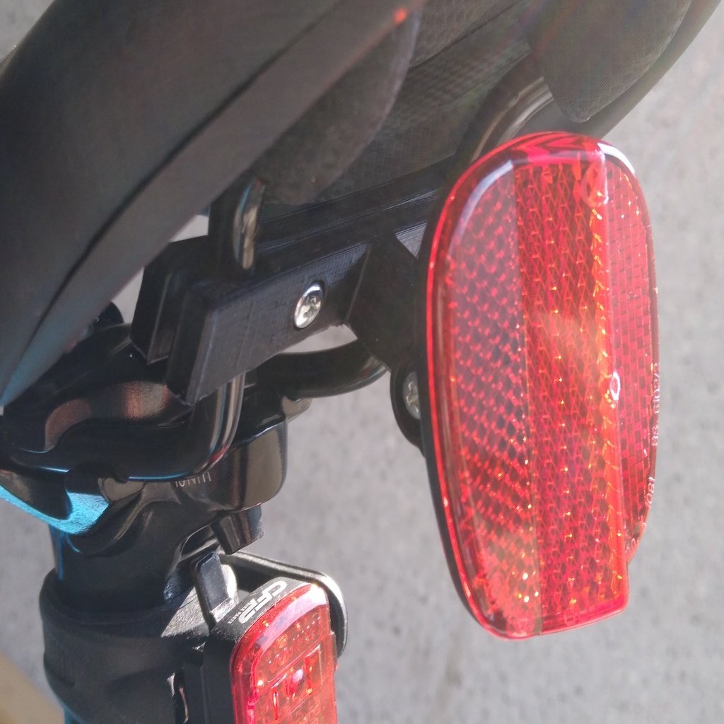 Soporte reflector para asiento de bicicleta