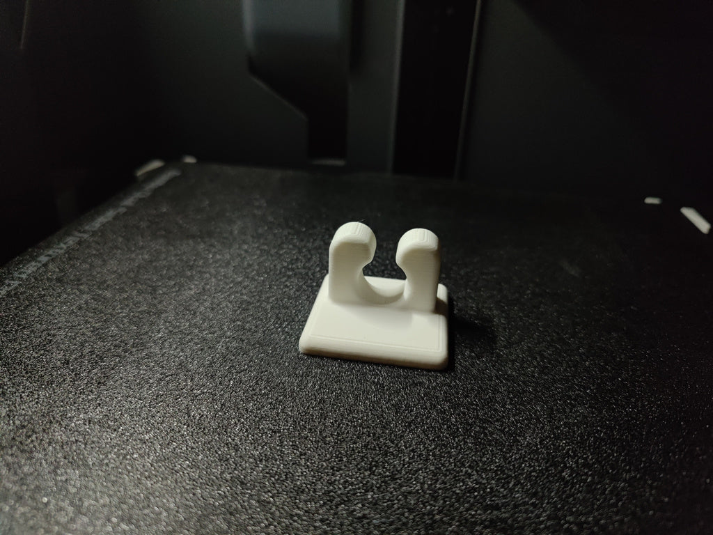 Soporte de pared para cables para cables organizados