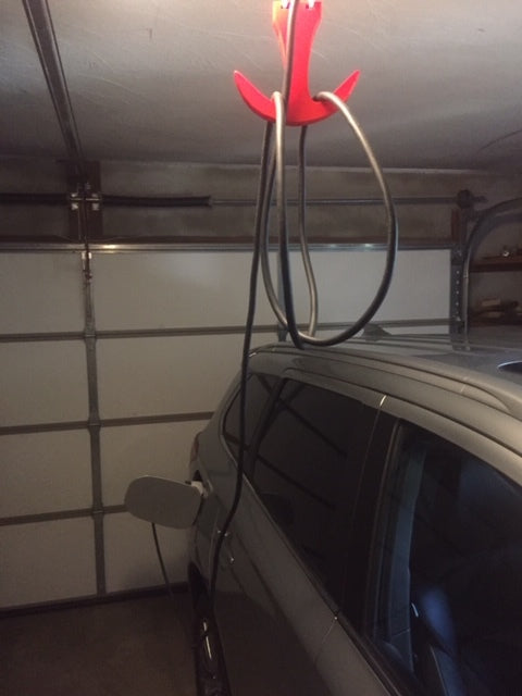 Gancho de almacenamiento para cable de carga Mitsubishi PHEV