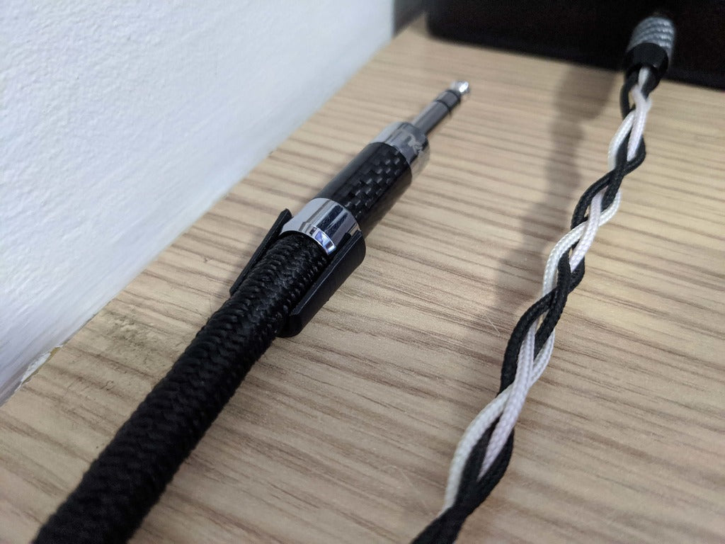 Soporte de cables para montaje con cinta adhesiva de doble cara o pegamento