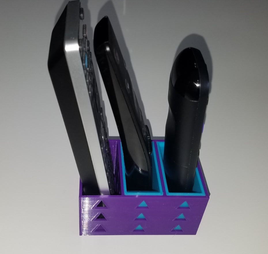 Soporte triple para mando a distancia