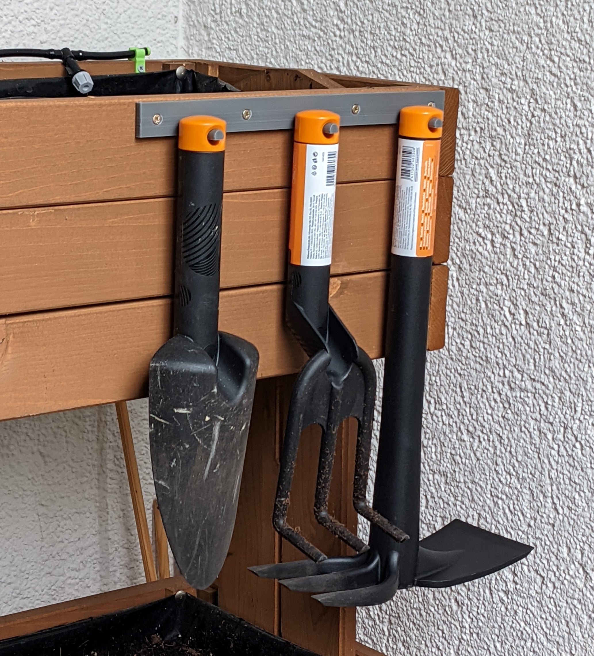 Soporte de pared para herramientas de jardín Fiskars