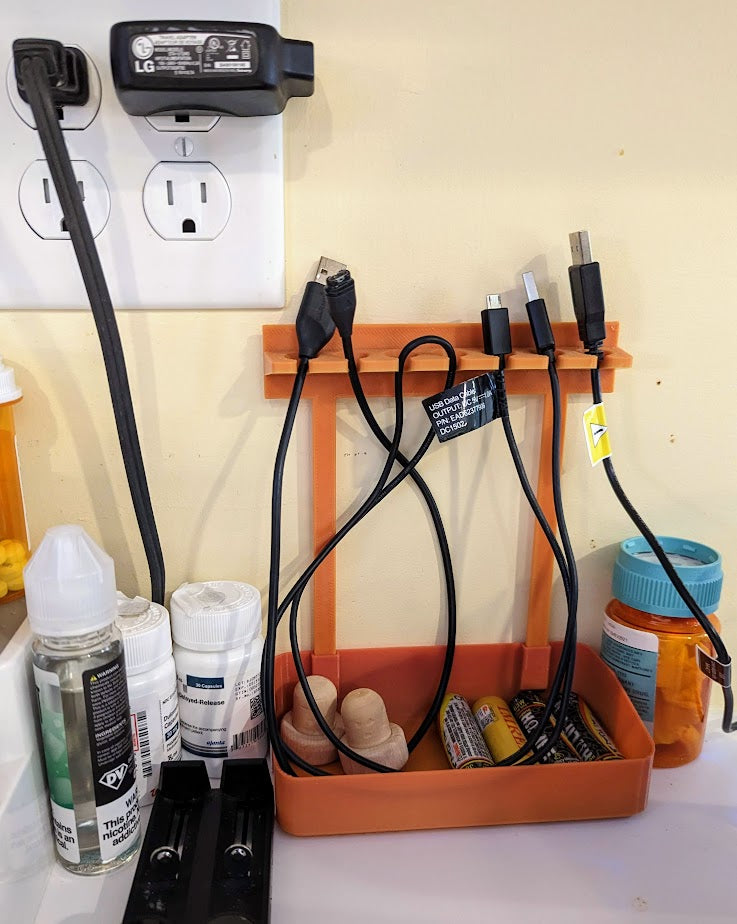 Soporte y organizador de cables USB