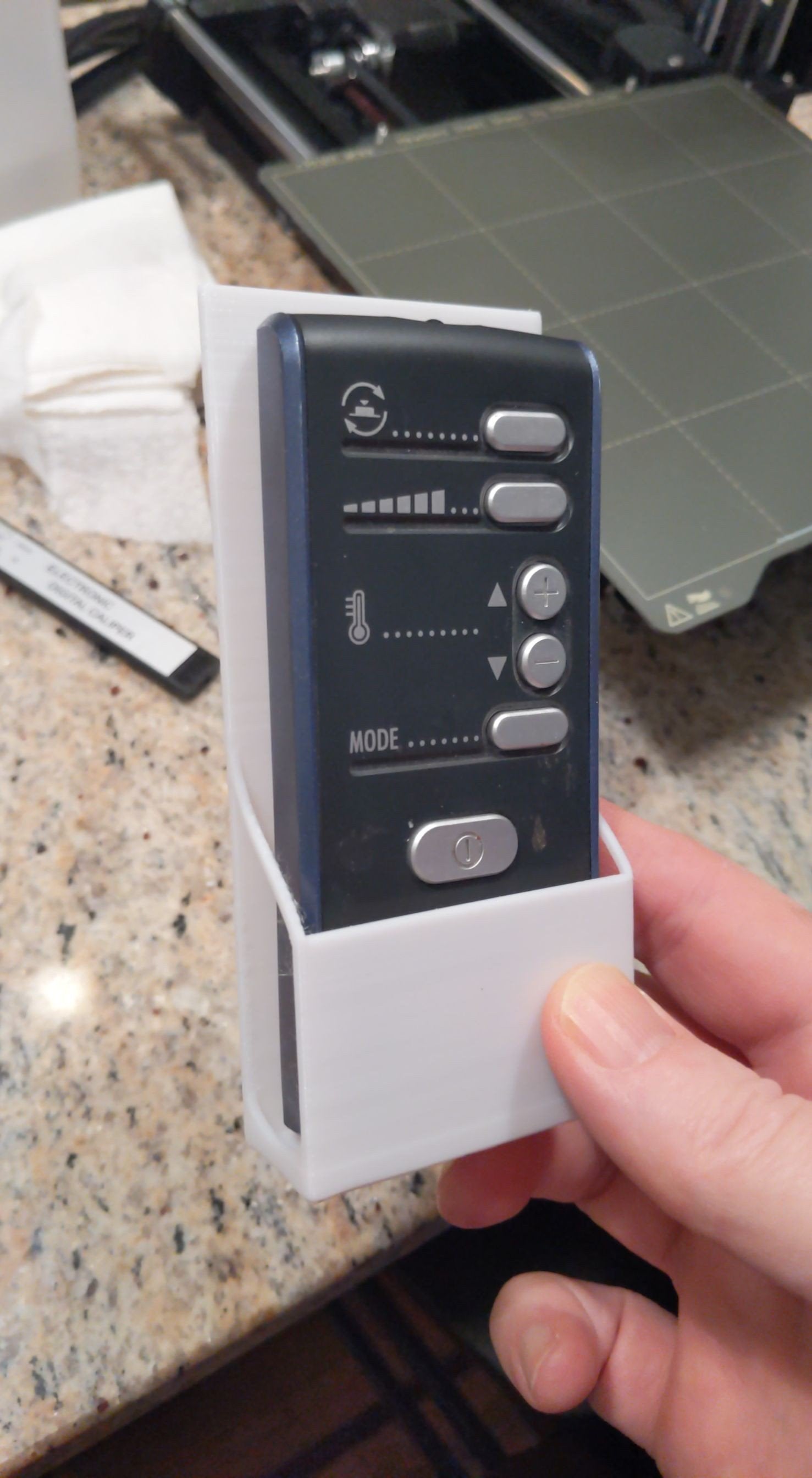 Soporte de pared para mando a distancia