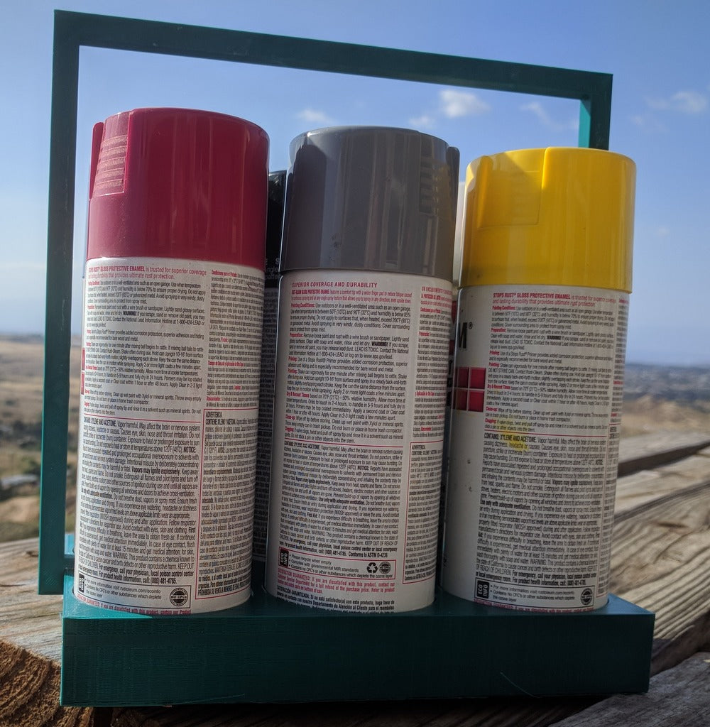 Soporte para latas de pintura en aerosol para seis latas.