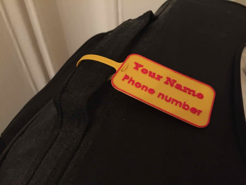 Etiqueta de equipaje para personalización con nombre y número de teléfono.