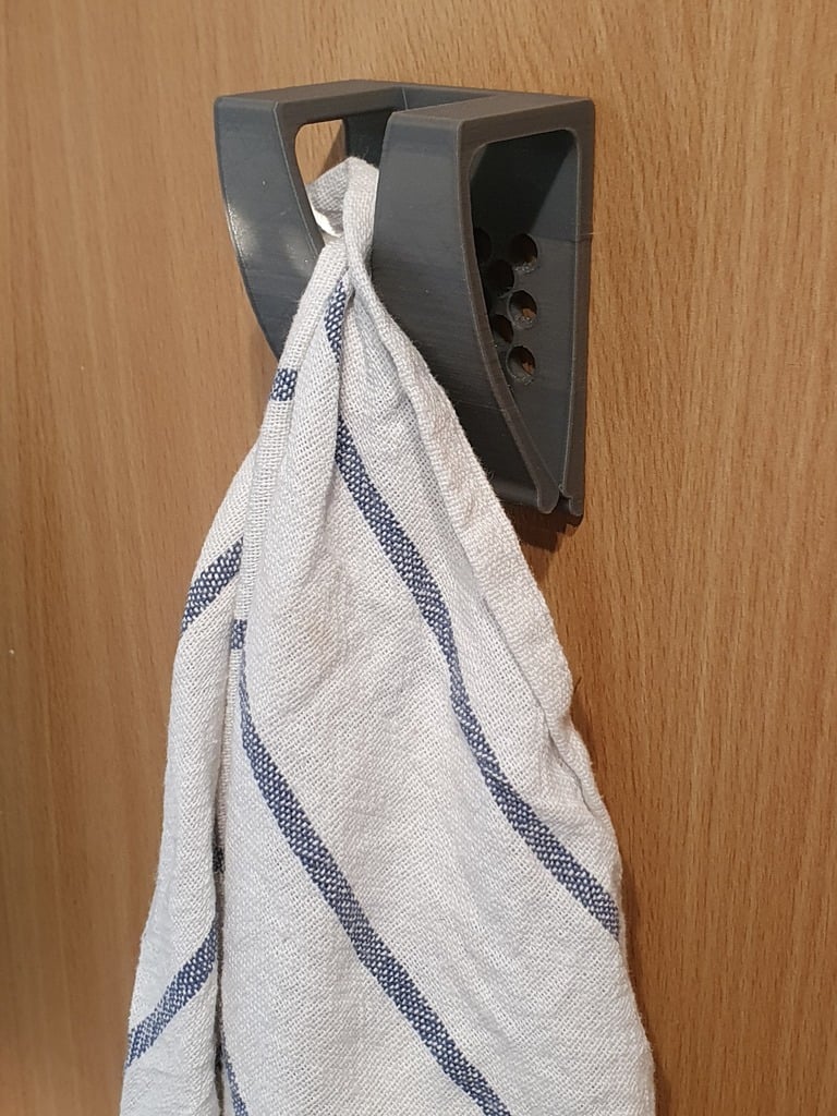 Gancho con clip para paño o toalla.