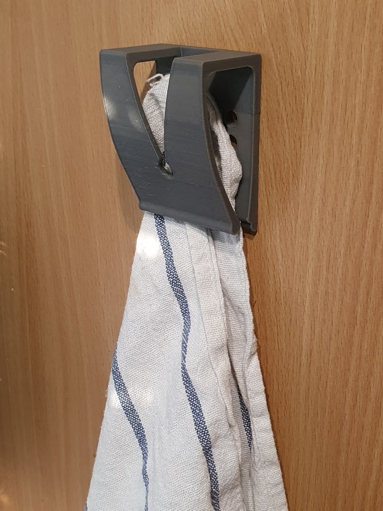 Gancho con clip para paño o toalla.