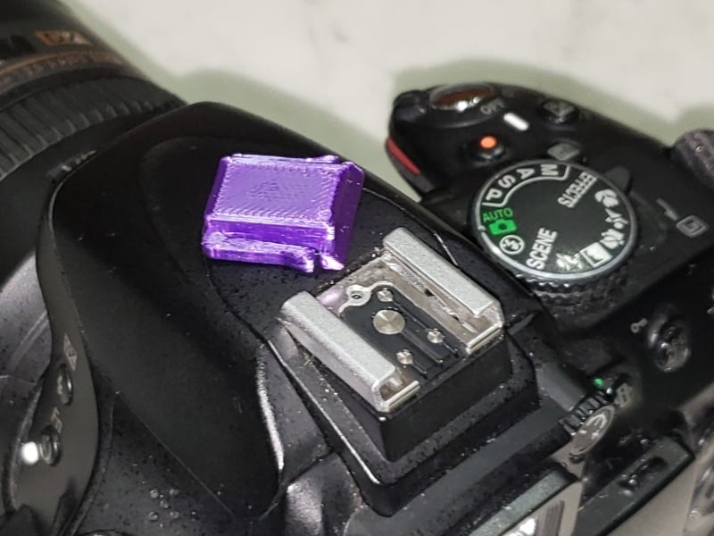 Base/cubierta del adaptador de zapata para cámaras Nikon